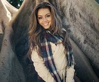 A smiling woman with long hair