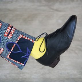 black shoe and yellow sock