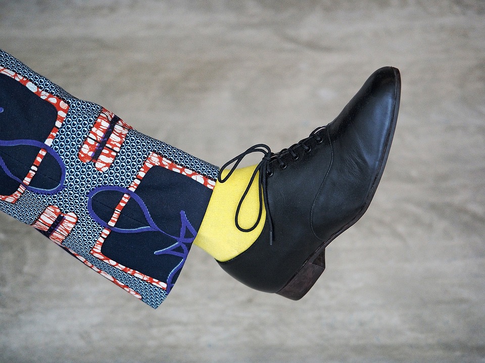 black shoe and yellow sock