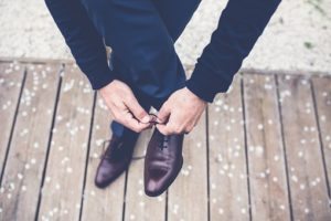 A man tying shoelace