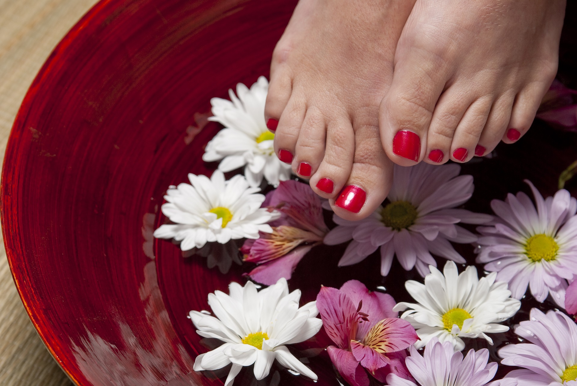 woman's feet with red nail