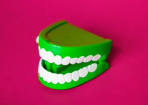 a green denture toy